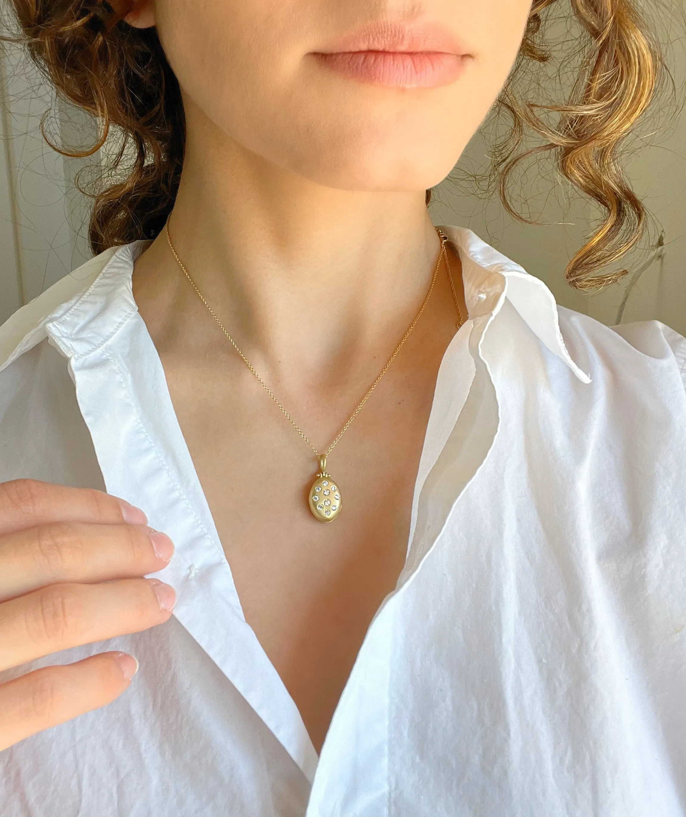 18 Karat Gold and Diamond Small Oval Locket